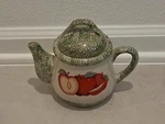 Decorated 1QT Teapot By Heart Treasures Ltd. 1996 Red Apple & Green Sponge Paint Used. Price: $29.50.