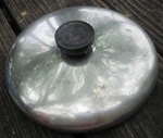 Preowned Used About 7" Lid Top Cover Rust Spots Black Handle Stainless?. Price: $15.00.